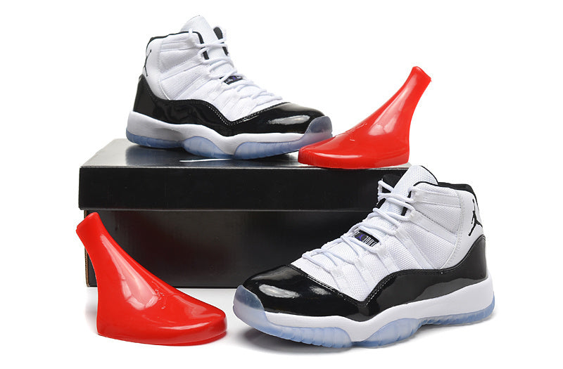 Air Jordan 11 Retro High White and Black Sneakers - product image from the listing.