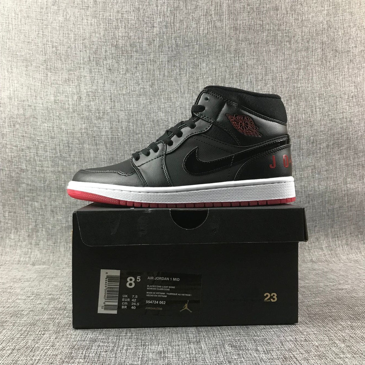 Air Jordan 1 Mid High-Top Sneakers in Black Red White - product image from the listing.