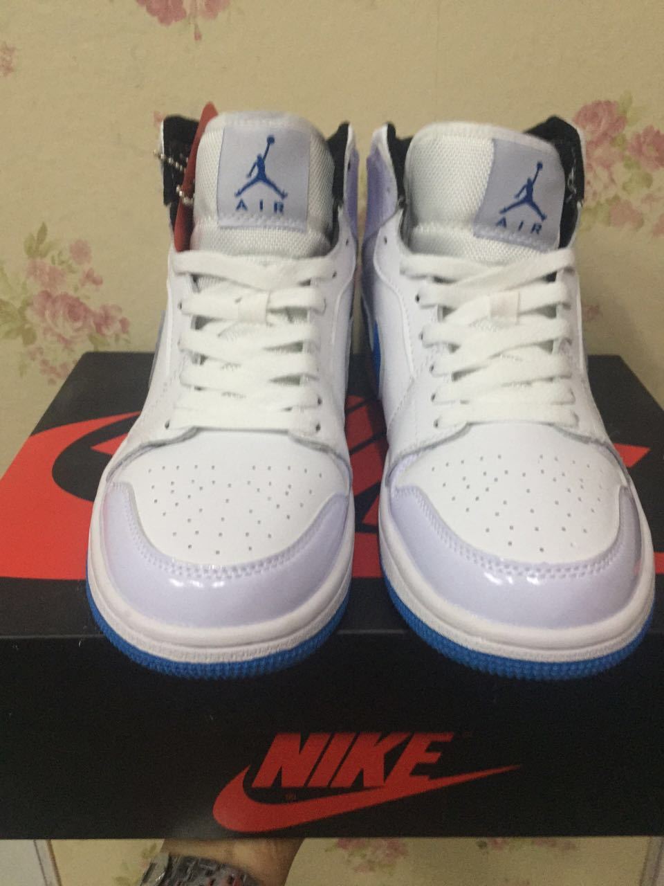 Air Jordan 1 High White and Royal Blue Sneakers - product image from the listing.