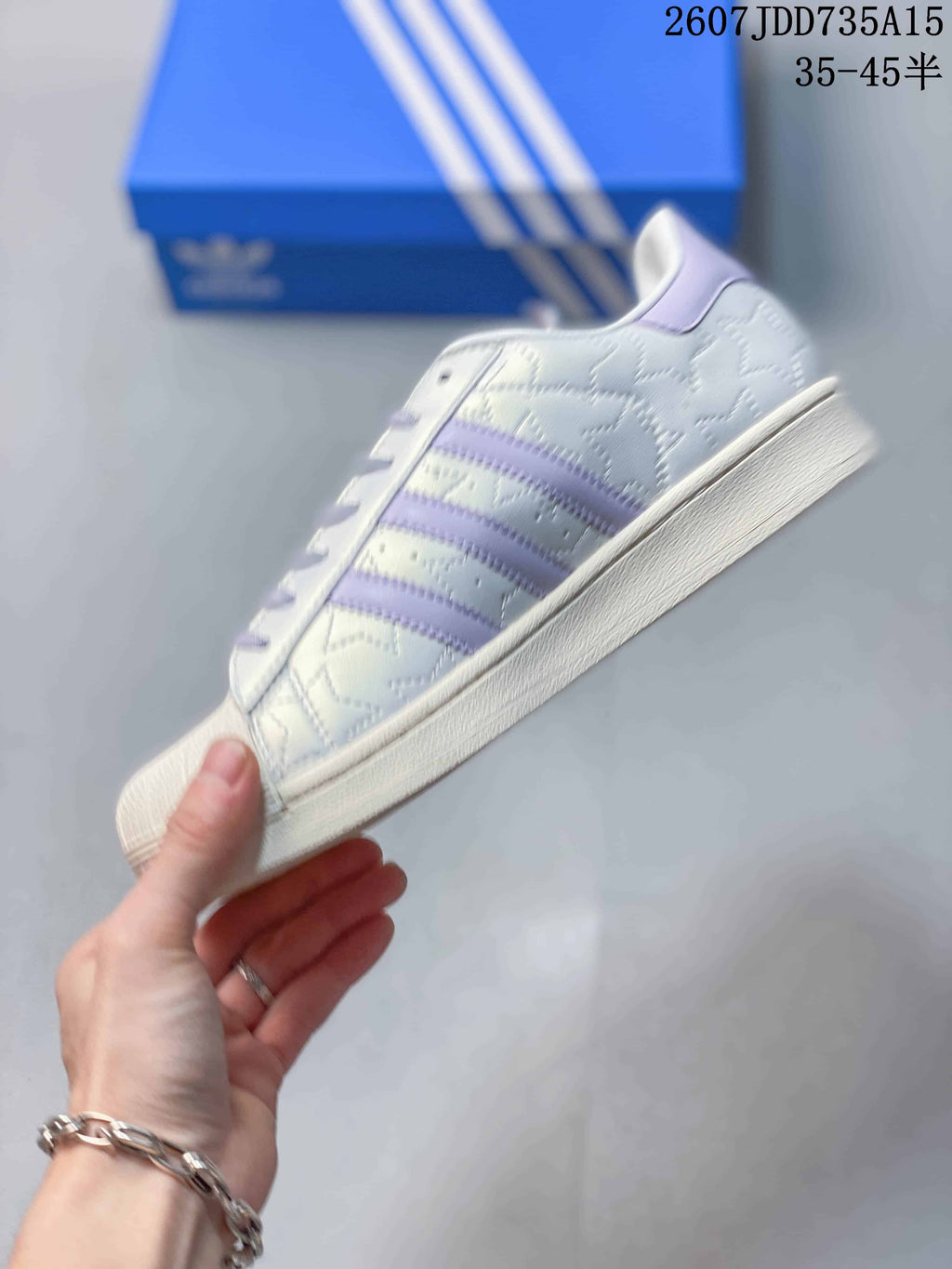 adidas Superstar White and Lavender Shell-Toe Trainers - product image from the listing.