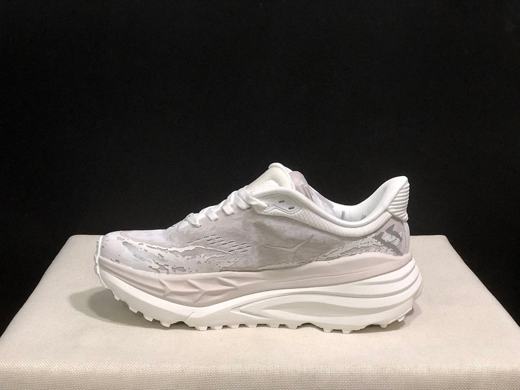HOKA Stinson 7 Sneakers in White and Gray - product image from the listing.
