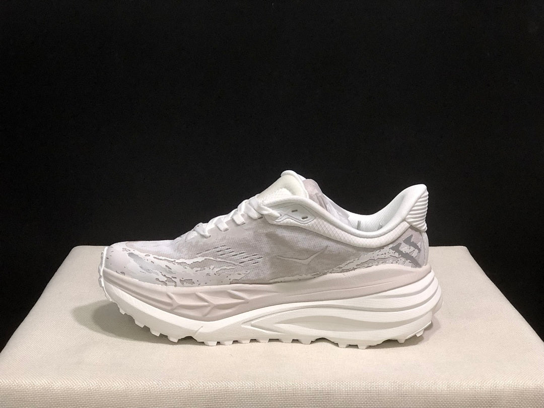 HOKA Stinson 7 Sneakers in White and Gray - product image from the listing.