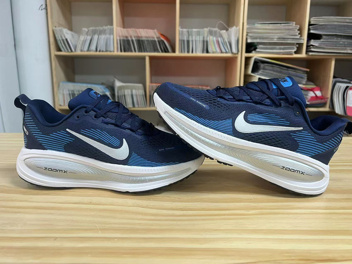 Navy and Blue Nike Vomero 18 Running Shoes - product image from the listing.
