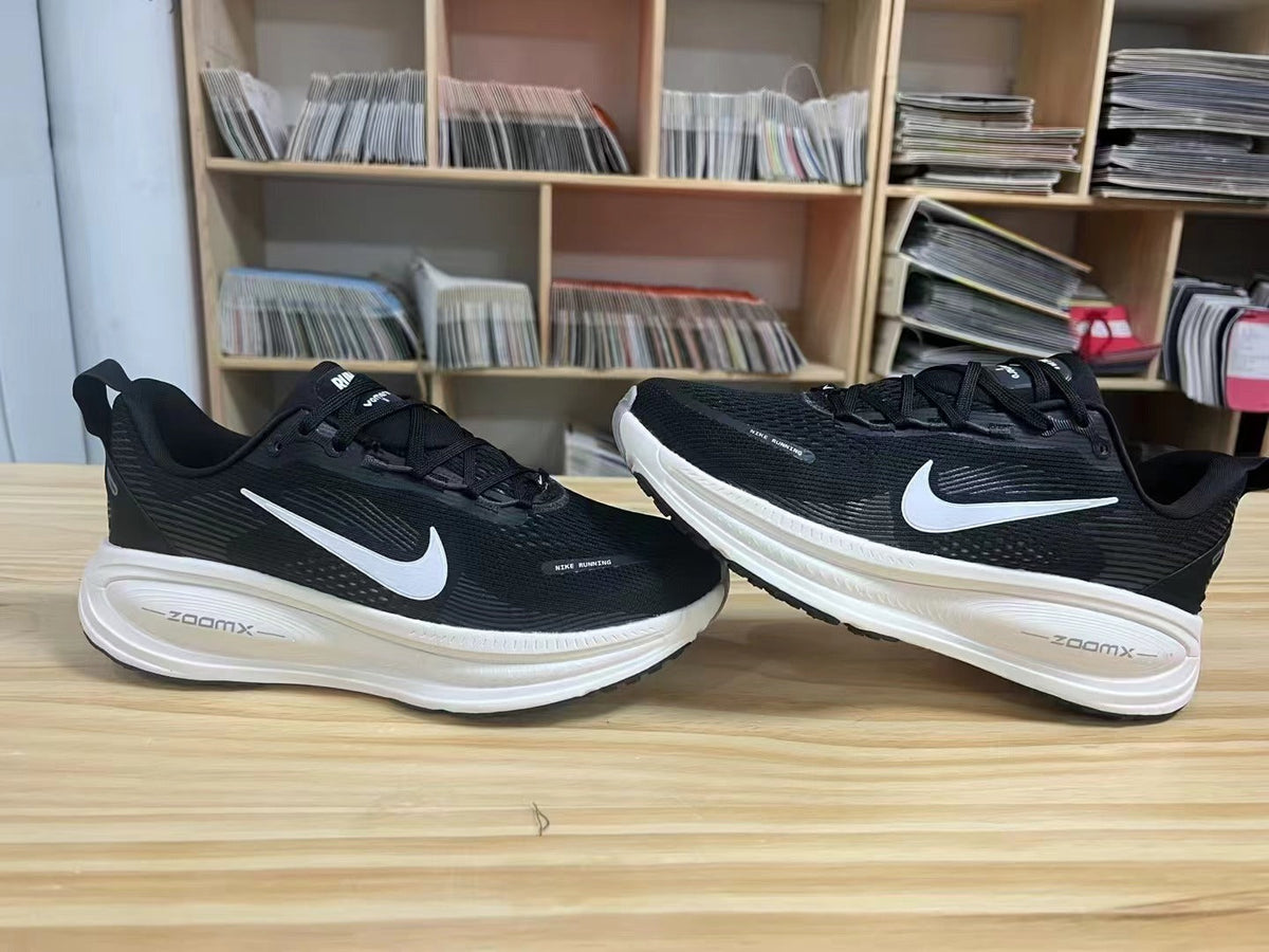 Nike Vomero 18 Running Shoes in Black and White - product image from the listing.