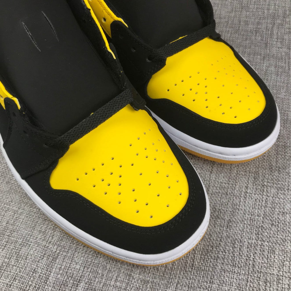 Air Jordan 1 Mid Sneakers in Black and Yellow - product image from the listing.