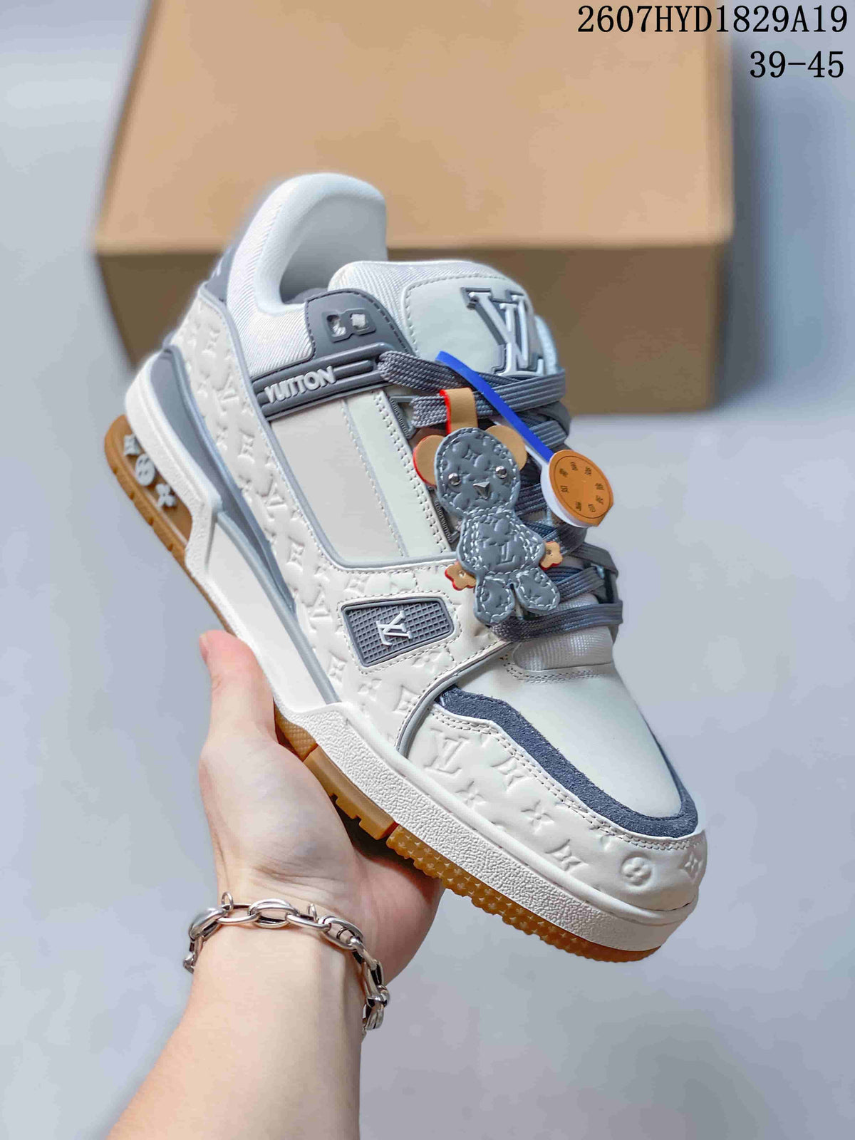 Louis Vuitton Trainer Maxi Low-Top Sneakers in White Gray - product image from the listing.