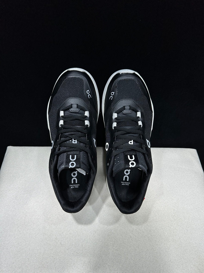 On THE ROGER Clubhouse Pro Tennis Sneakers in Black and White - product image from the listing.