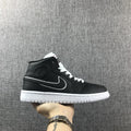Air Jordan 1 Mid Sneakers in Black and White 852542-016 - product image from the listing.