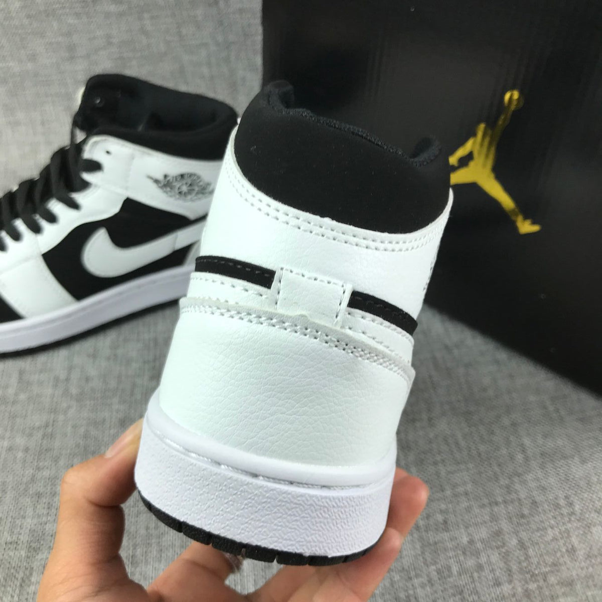 Air Jordan 1 Mid Black White Sneakers 554724-113 - product image from the listing.