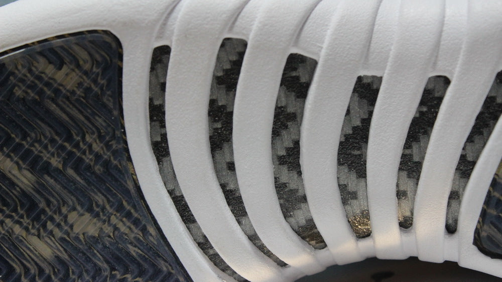 Air Jordan 12 Wings Black White Gold Sneakers 848692-033 - product image from the listing.