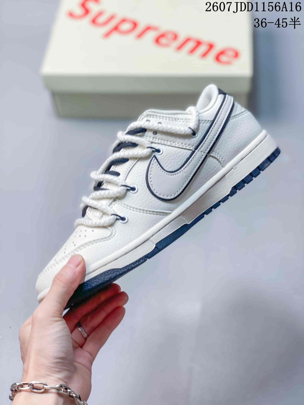 Nike SB Dunk Low Supreme Sneakers in Off-White - product image from the listing.