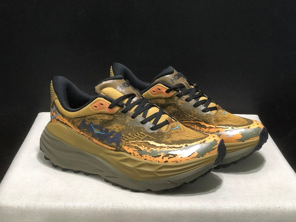 HOKA Stinson 7 Trail Shoes for Running in Camo - product image from the listing.