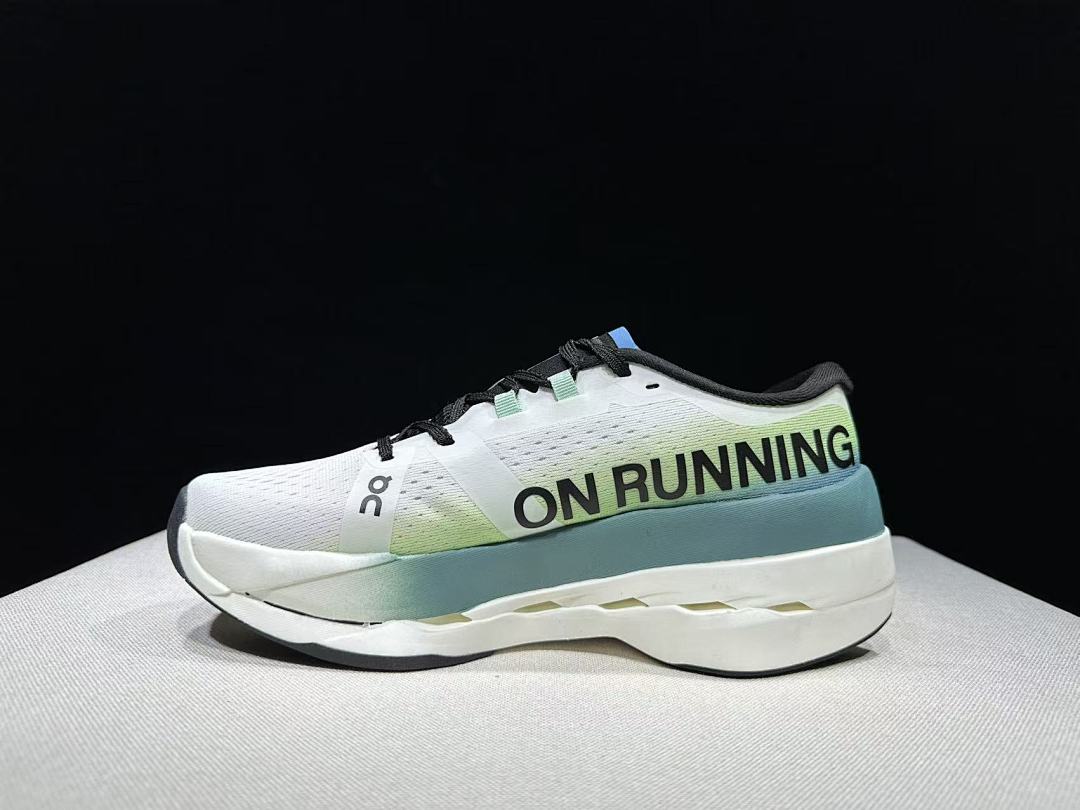 On Cloudboom Max Running Shoes, in White and Green - product image from the listing.