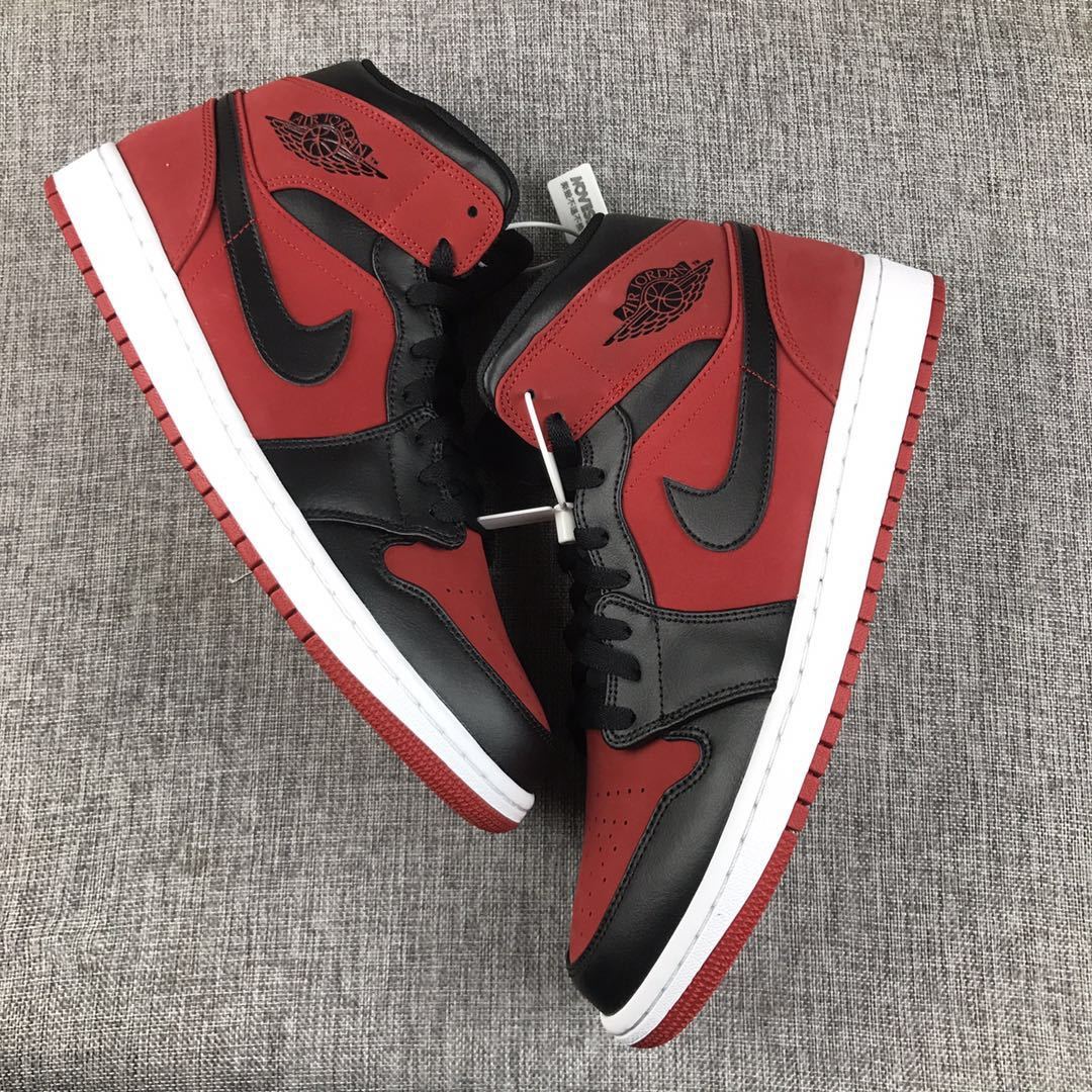 Air Jordan 1 Mid Sneakers in Red, in Black and White - product image from the listing.
