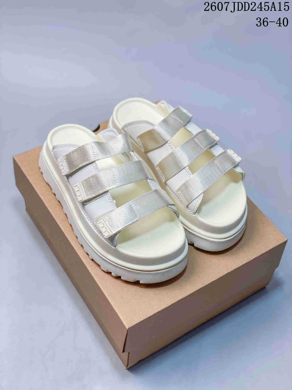White UGG GoldenGlow Slide Sandals - product image from the listing.