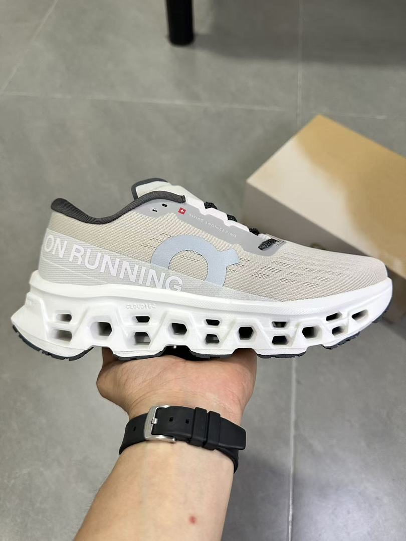 Gray and White On Running Cloudmonster Sneakers - product image from the listing.
