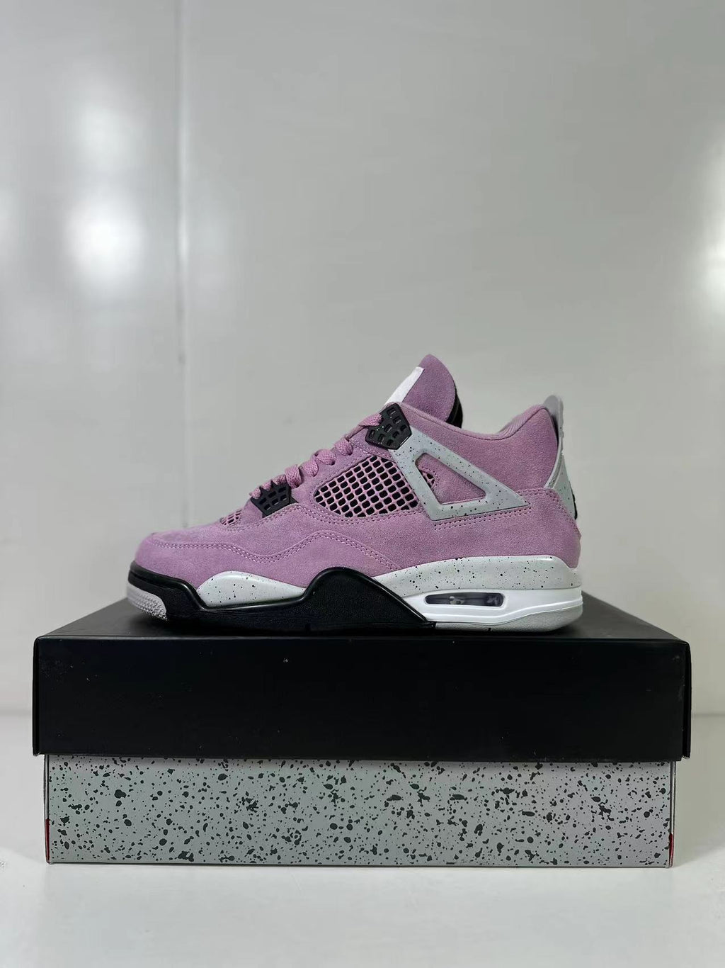 Air Jordan 4 Retro Orchid Pink Sneakers AQ9129-501 - product image from the listing.