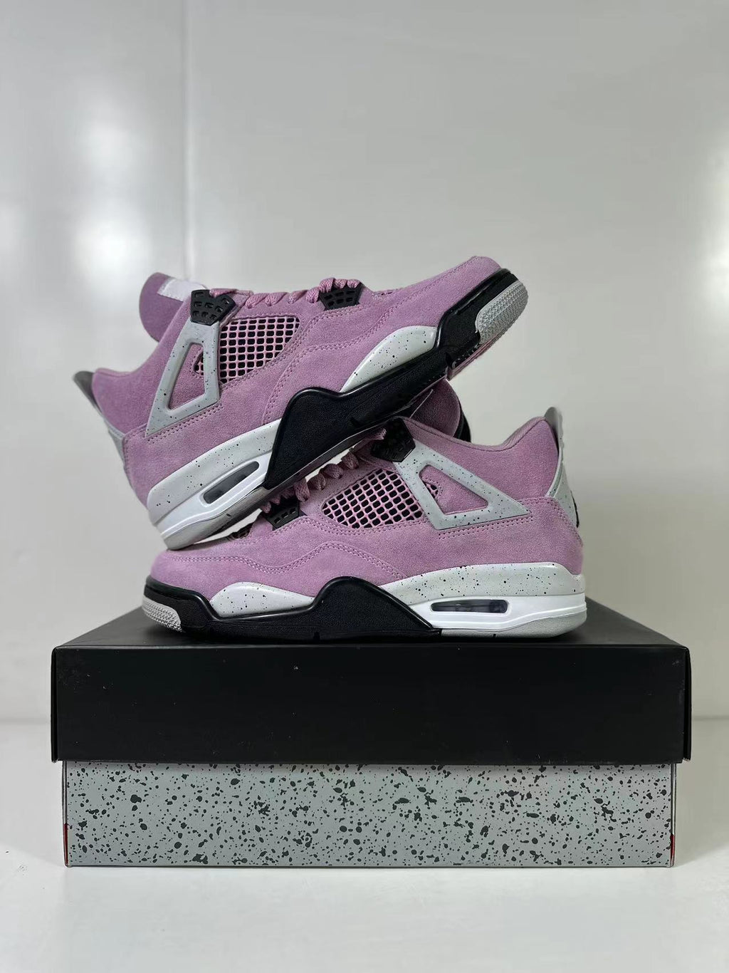 Air Jordan 4 Retro Orchid Pink Sneakers AQ9129-501 - product image from the listing.