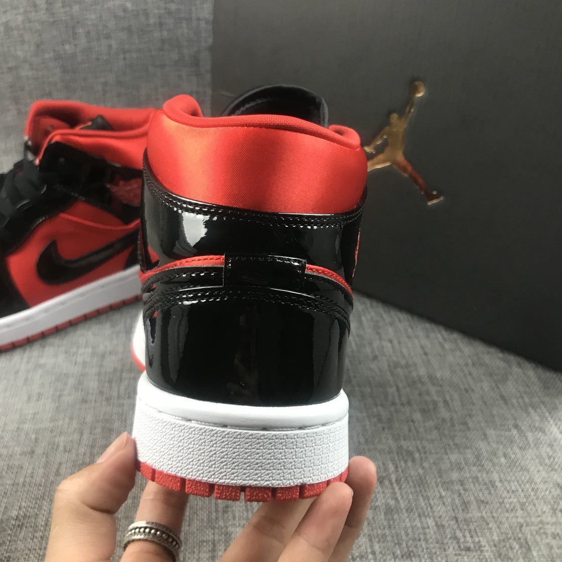 Air Jordan 1 Mid Sneakers in Black Red White BQ6472-600 - product image from the listing.