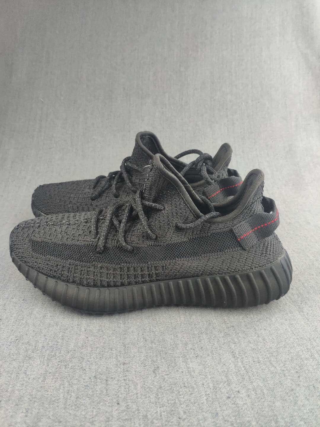 Yeezy Boost 350 V2 Sneakers in Dark Gray Knit - product image from the listing.