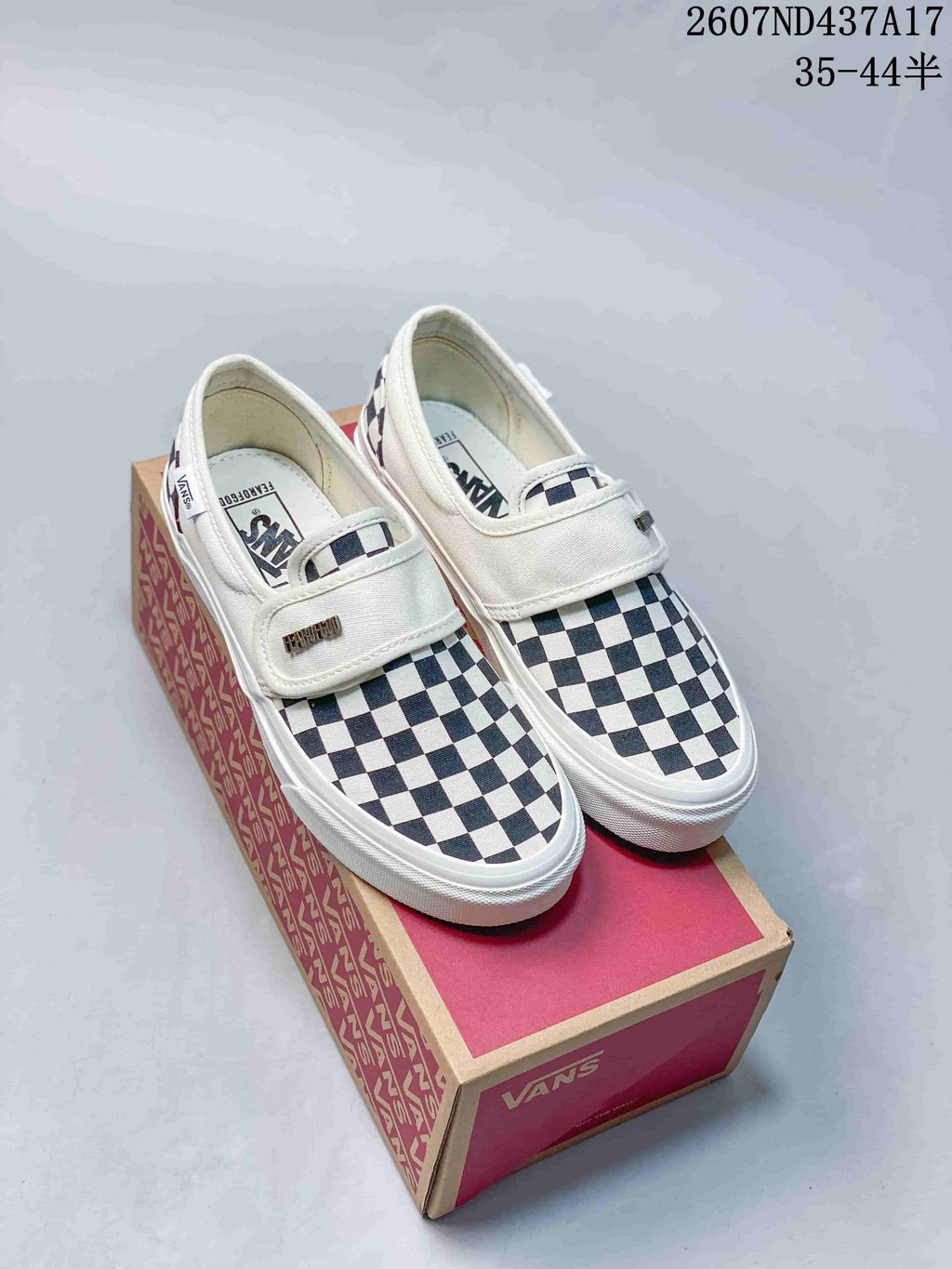 Vans Slip-On Trainers in Red/Navy and Checkerboard - product image from the listing.