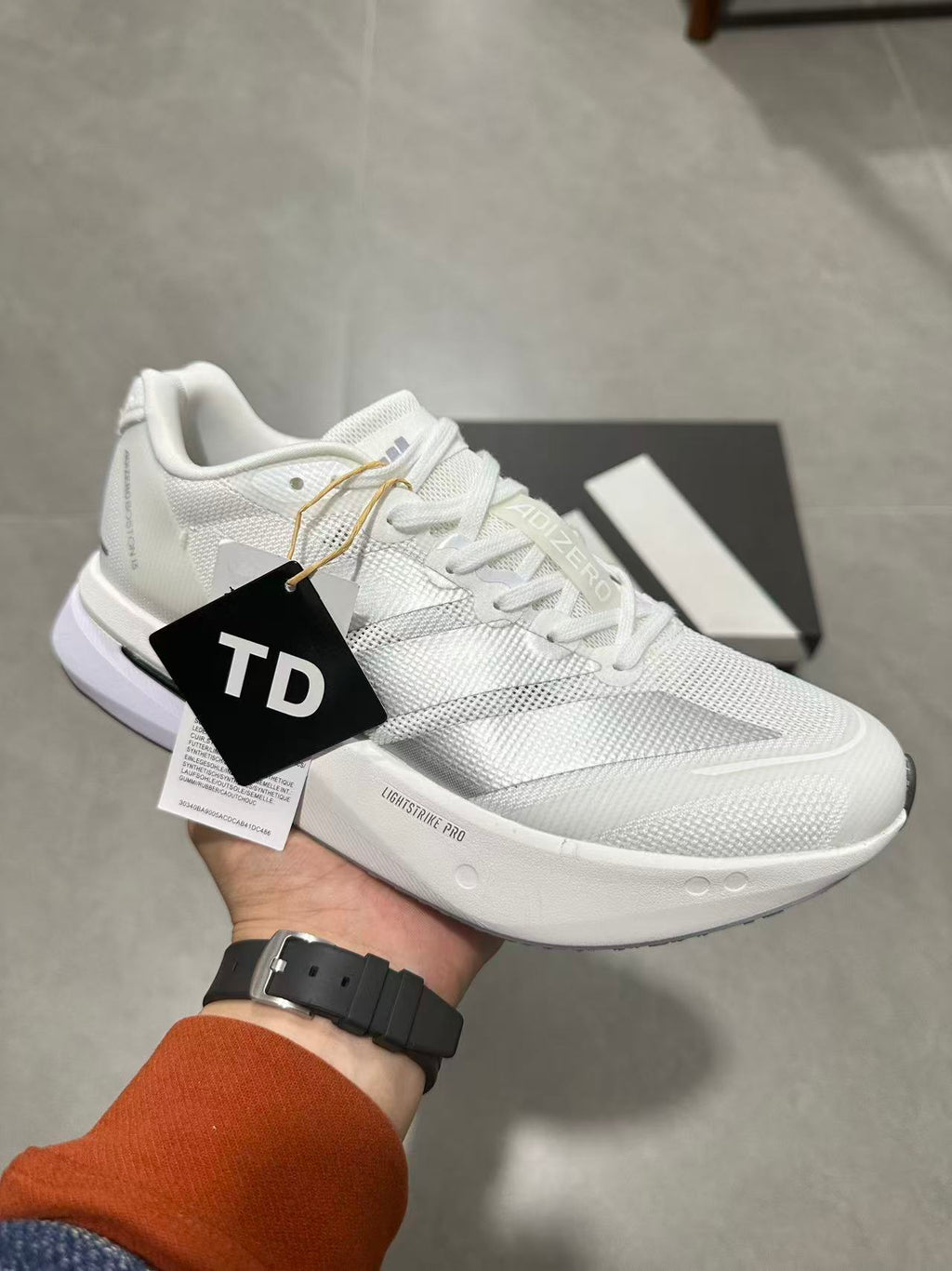 Adidas Adizero Lightstrike Pro Running Shoes in White - product image from the listing.