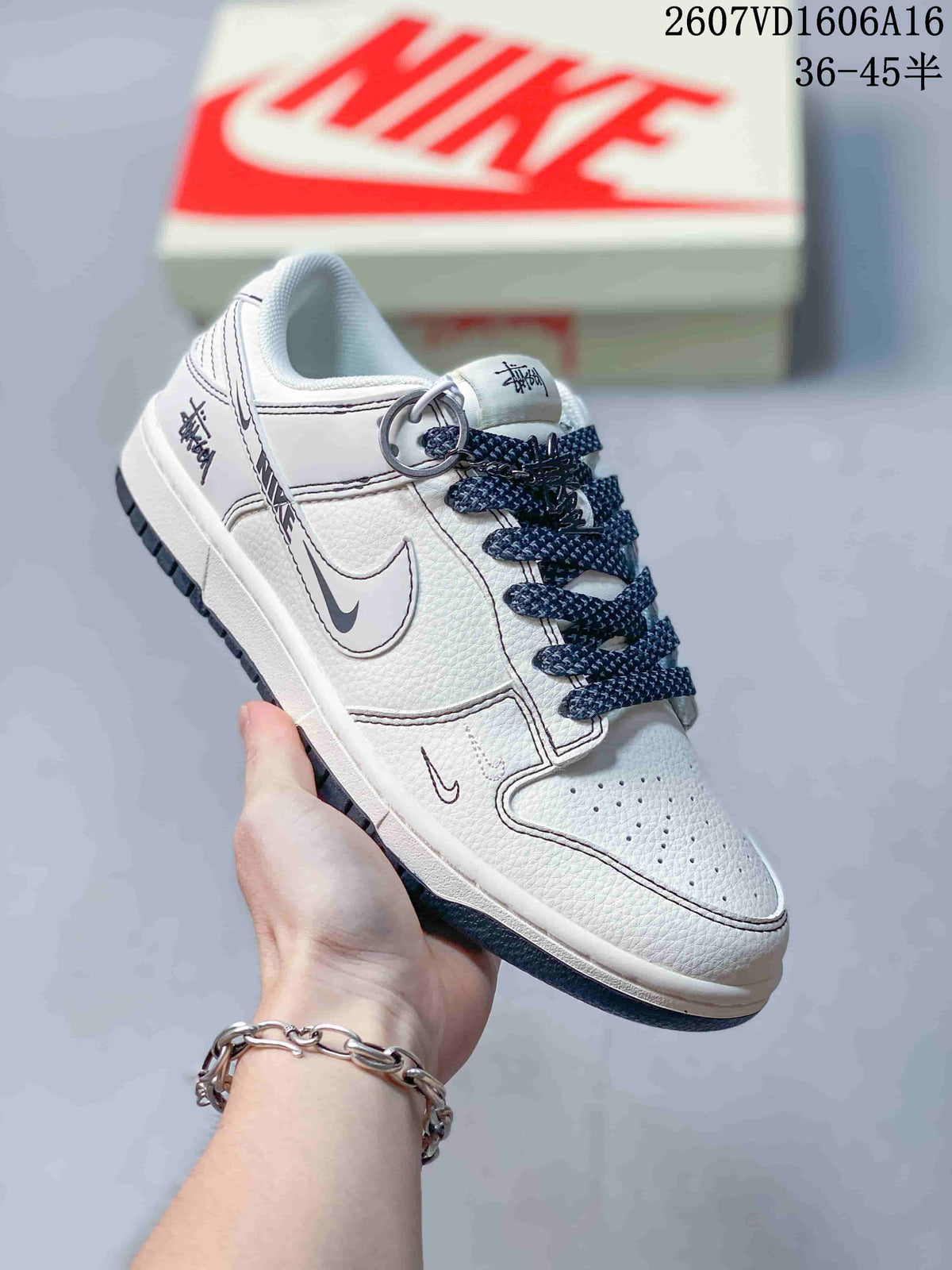 Nike SB Dunk Low White Gray Monogram-Style Trainers - product image from the listing.