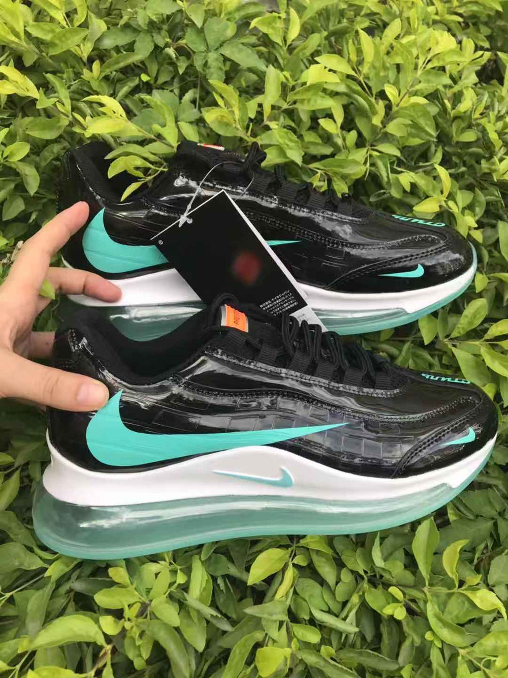 Black and Turquoise Nike Air Max 720 Sneakers - product image from the listing.