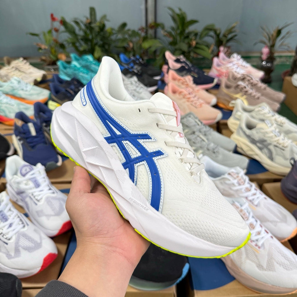 ASICS Novablast 5 LE Running Shoes in White Blue - product image from the listing.