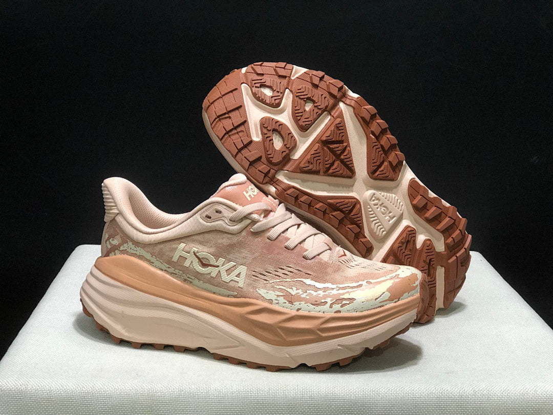 HOKA Stinson 7 Trail Running Shoes in Blush and in Cream - product image from the listing.