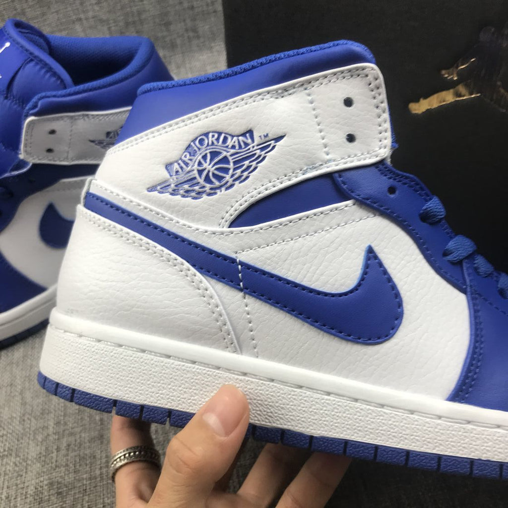 Hyper Royal Sneakers, White and Blue, - Jordan 1 Mid 554724-114 - product image from the listing.