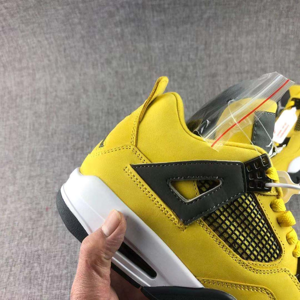 Air Jordan 4 Lightning Yellow Black Sneakers - product image from the listing.