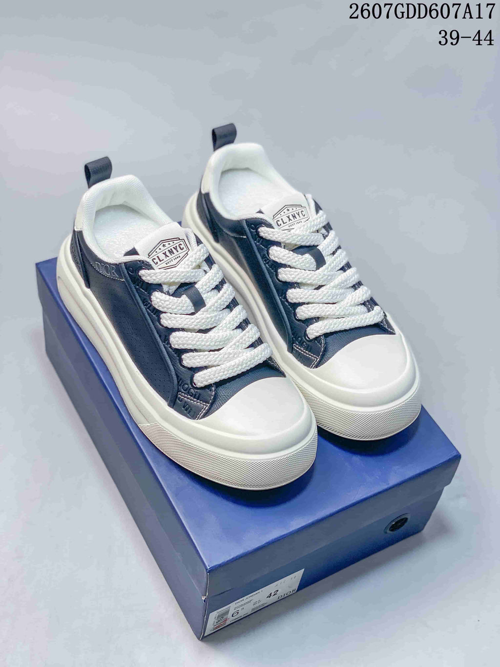 Dior Low-Top Sneakers in White and Navy 2607GDD607A17 - product image from the listing.