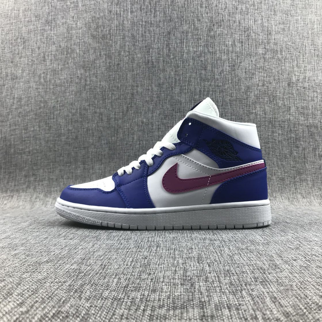 Air Jordan 1 Mid Sneakers in Blue Pink 554724-451 - product image from the listing.