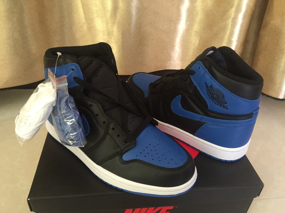 Jordan 1 High Sneakers in Black and Royal Blue - product image from the listing.