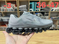 Nike Air Liquid Max Running Sneakers, in Light Gray and Black - product image from the listing.