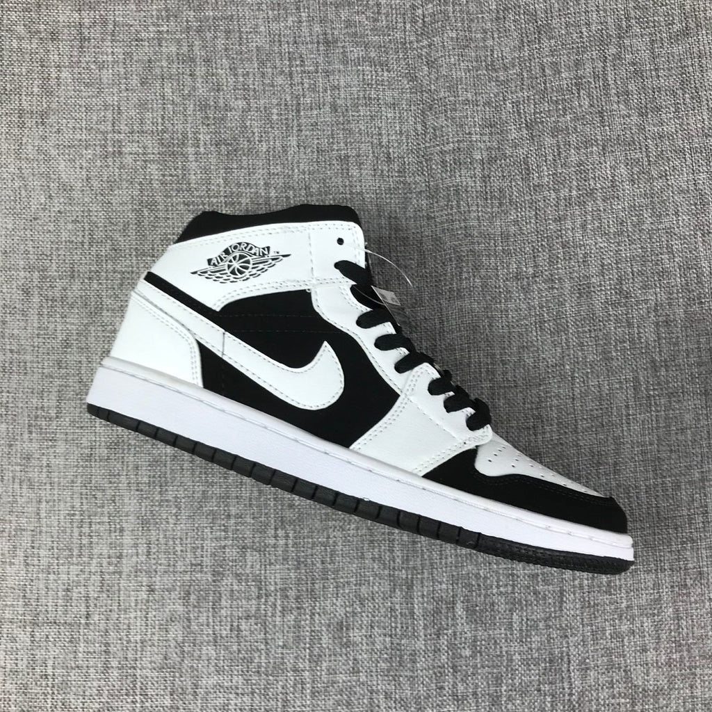 Air Jordan 1 Mid Black White Sneakers 554724-113 - product image from the listing.