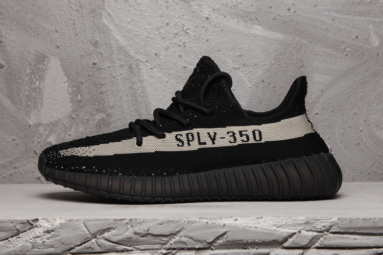 Yeezy 350 V2 Sneakers in Black and Cream - product image from the listing.