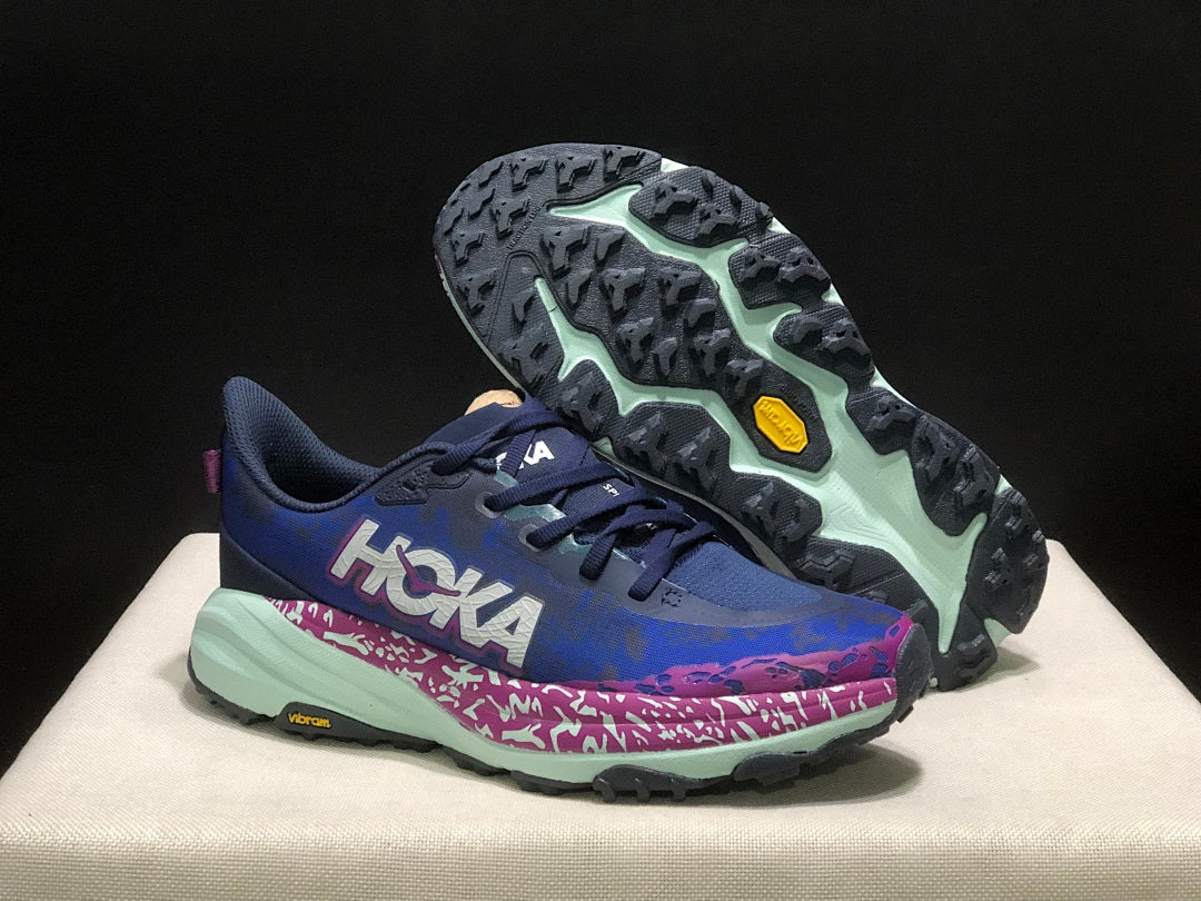 HOKA Speedgoat 6 Trail Running Shoes, in Blue and Pink - product image from the listing.