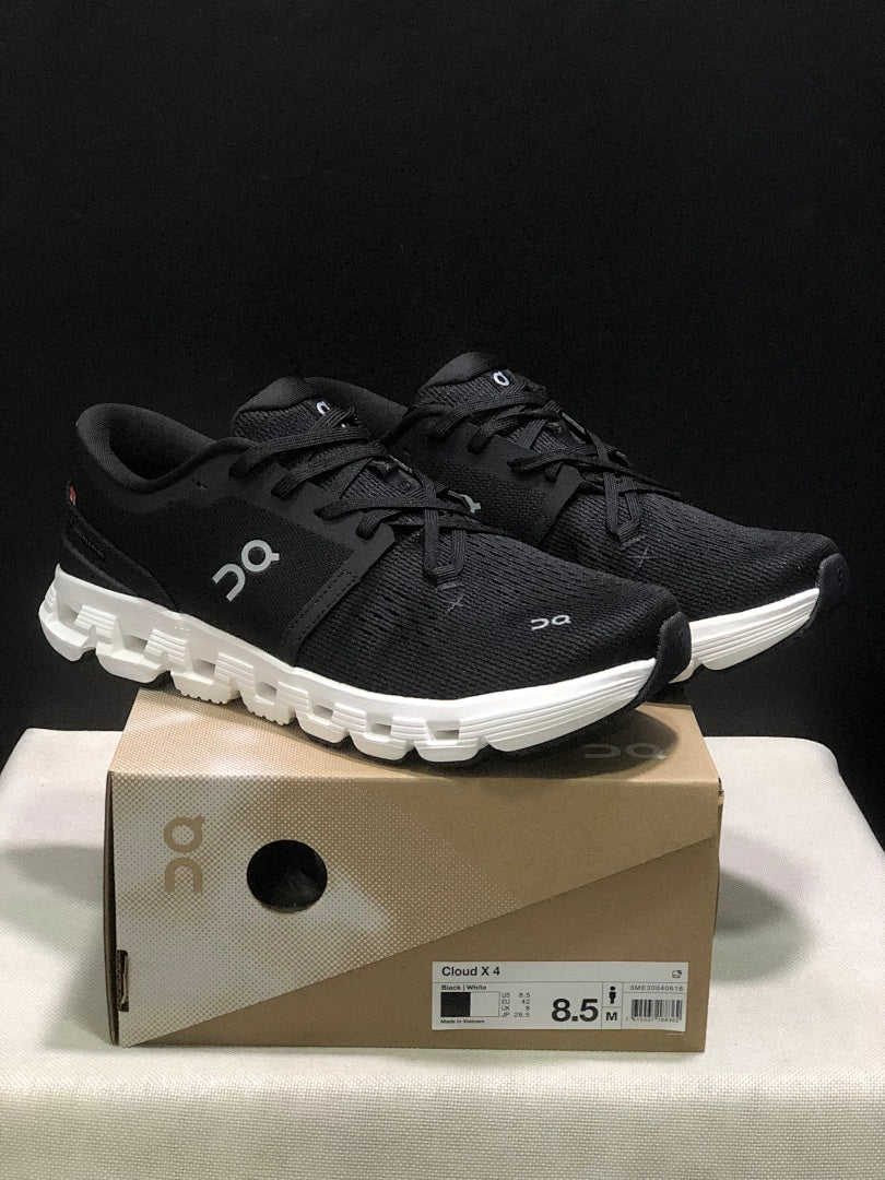 On Cloud X 4 Sneakers in Black and White - product image from the listing.
