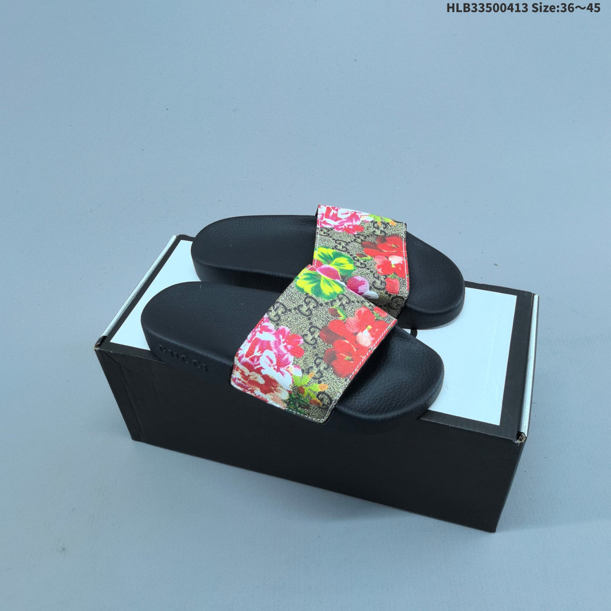 Floral Print Slide Sandals with Black Footbed by Gucci - product image from the listing.