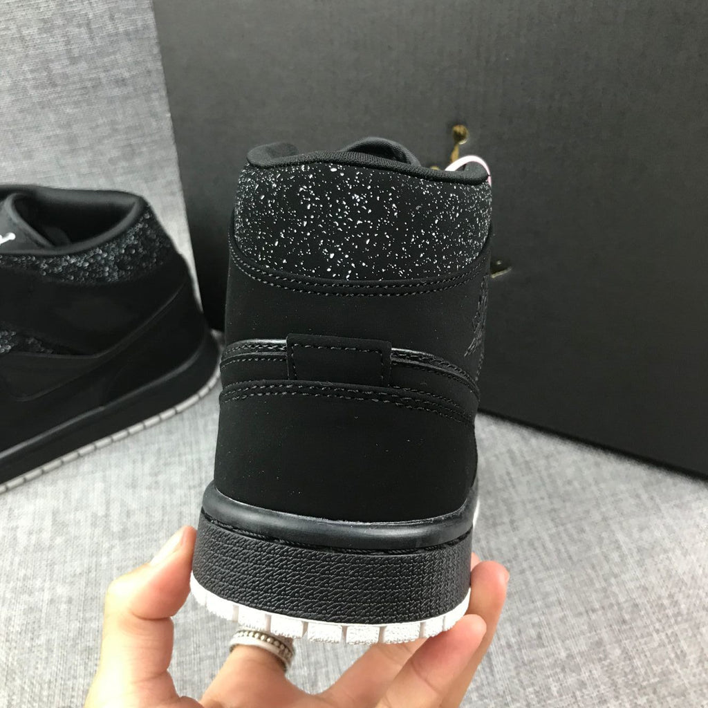 Air Jordan 1 Mid Black and White Sneakers 554724-001 - product image from the listing.