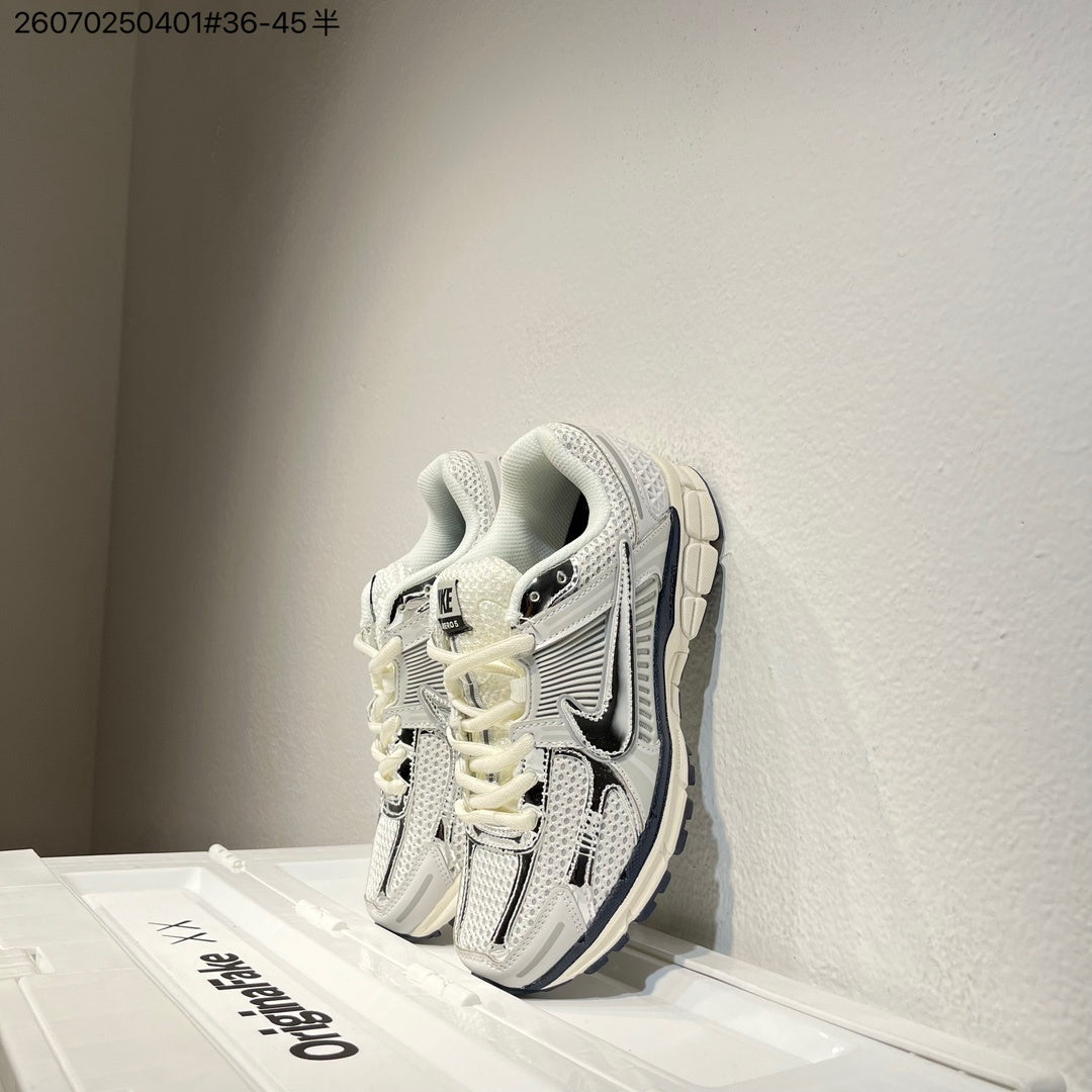 Nike Air Zoom Vomero 5 Sneakers, in White and Black - product image from the listing.