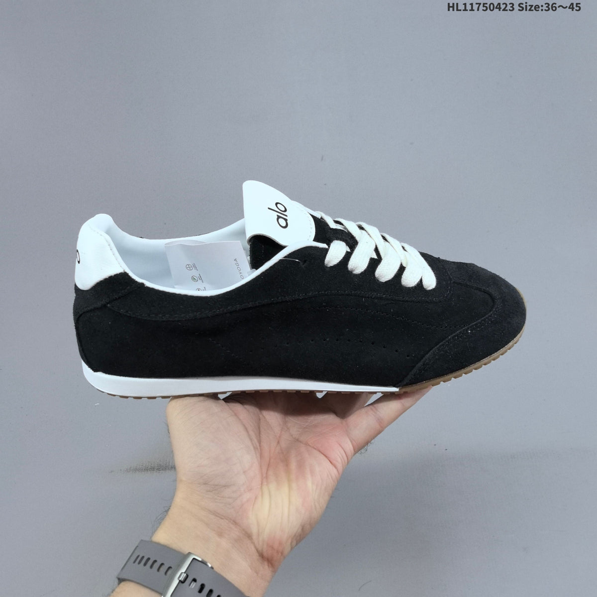 Black and Ivory Alo Yoga Sunset Sneaker - product image from the listing.
