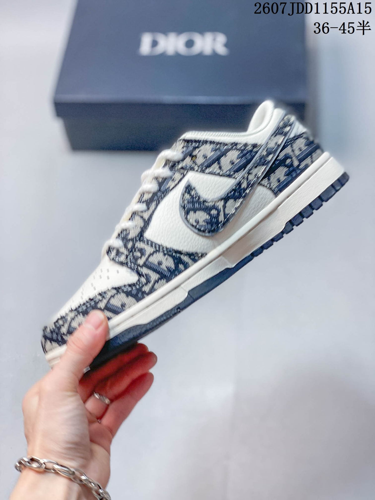 Nike SB Dunk Low White Navy Dior Pattern Trainers - product image from the listing.