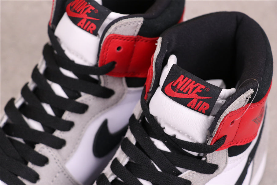 Air Jordan 1 High Sneakers in Light Smoke Grey 555088-126 - product image from the listing.