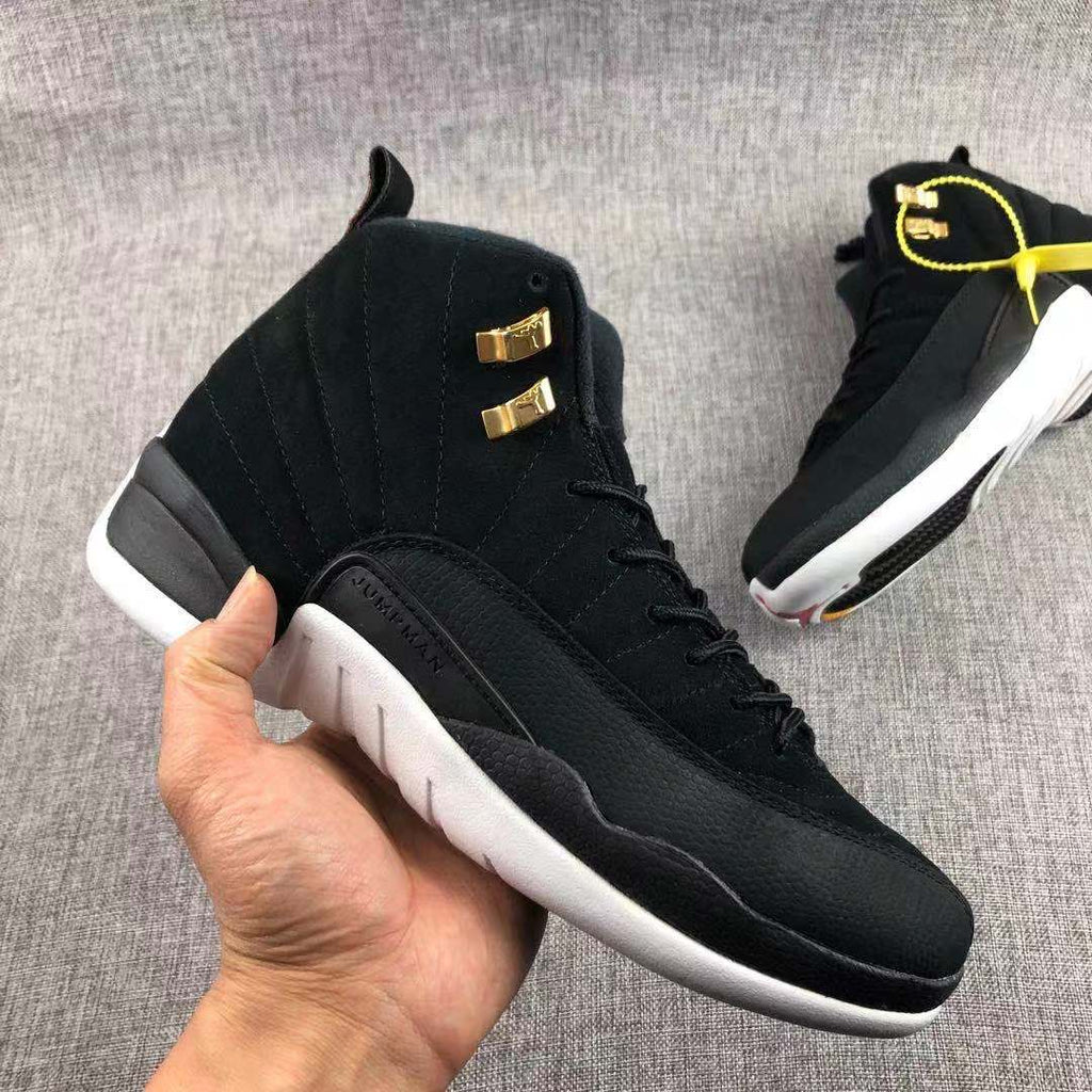 Air Jordan 12 Black Gold Sneakers 130690-017 - product image from the listing.