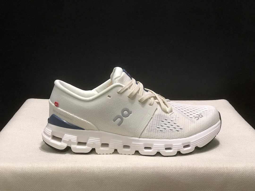On Cloud X 4 Sneakers in Ivory and Blue - product image from the listing.