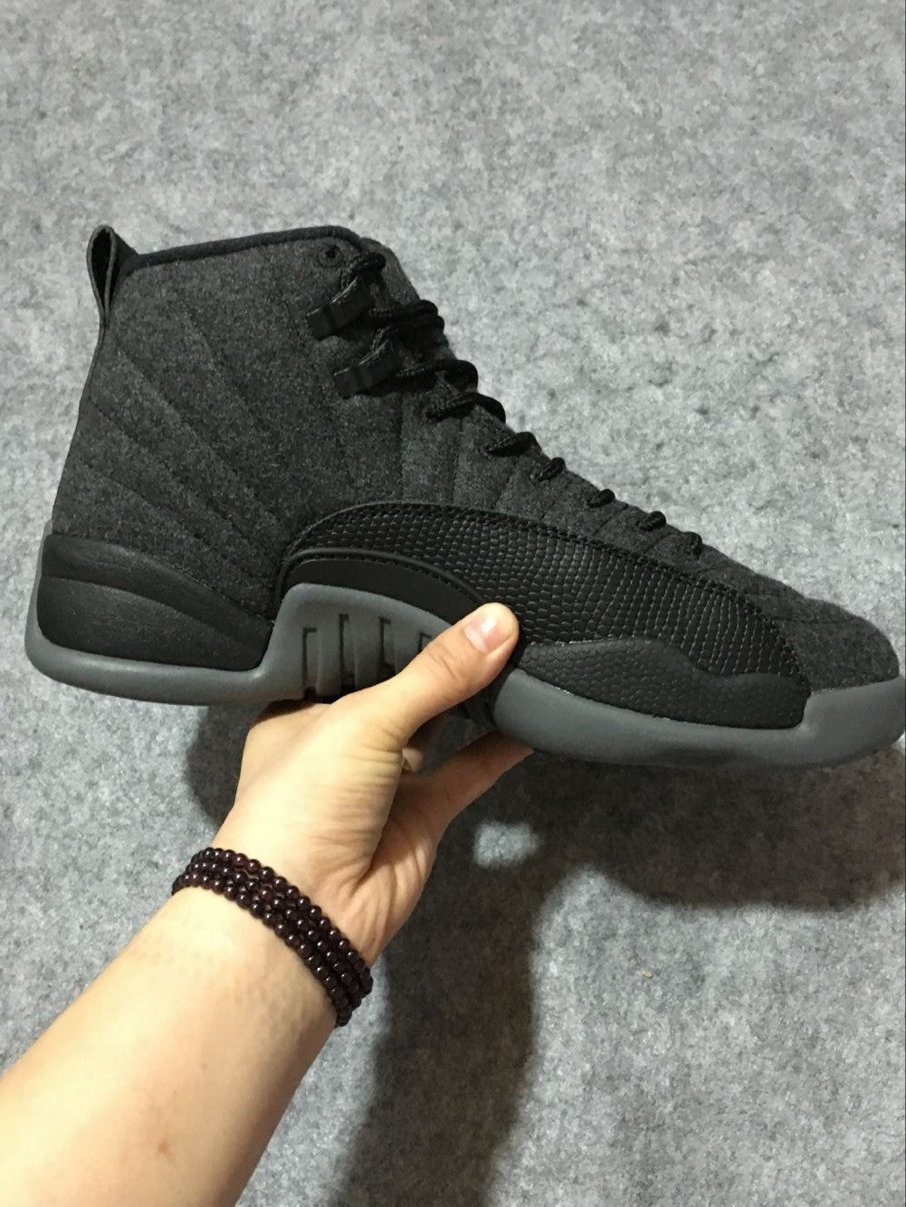 Black and Grey Air Jordan 12 High-Top Sneakers - product image from the listing.