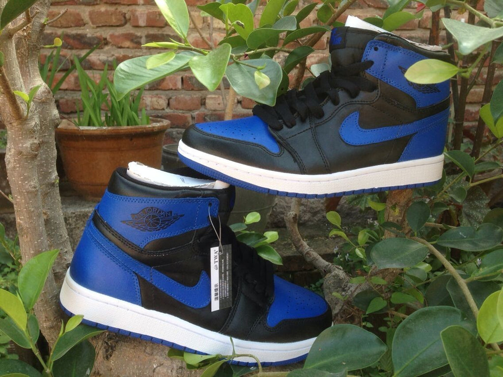 Jordan 1 High Basketball Sneakers in Blue and Black - product image from the listing.